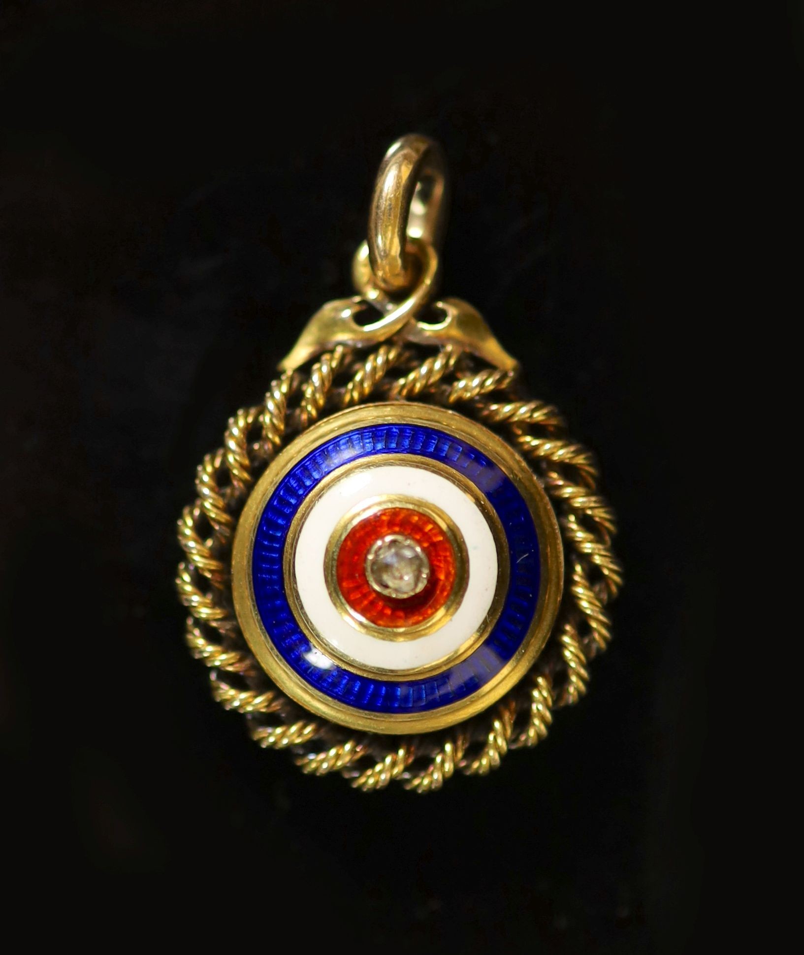 A Victorian gold, three colour enamel and rose cut diamond set circular target pendant
